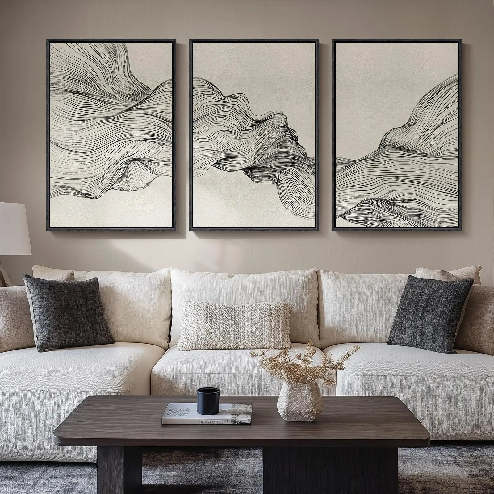 Modern living room with a white sofa, abstract wall art, and a wooden coffee table.