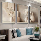 Decorative wall art with vases and flowers in a living room setting.