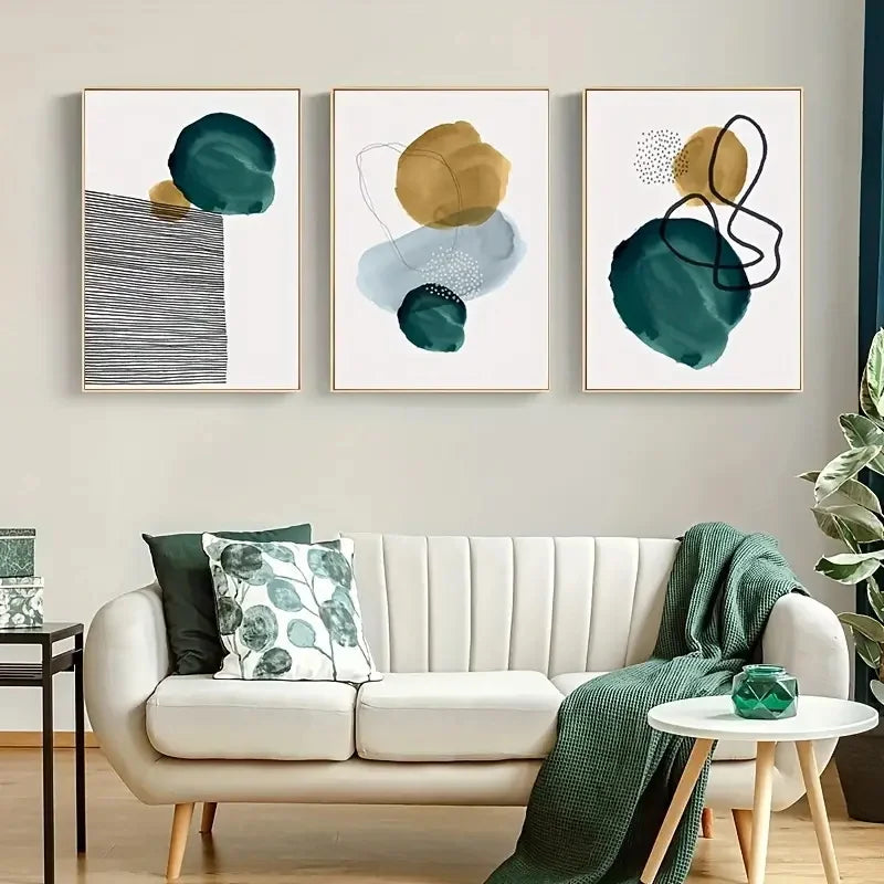 Modern living room with a white sofa, abstract art on the wall, and decorative items.