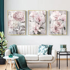 Floral wall art above a white sofa in a living room setting