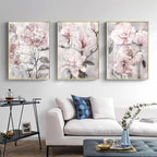 Floral wall art above a sofa in a living room setting