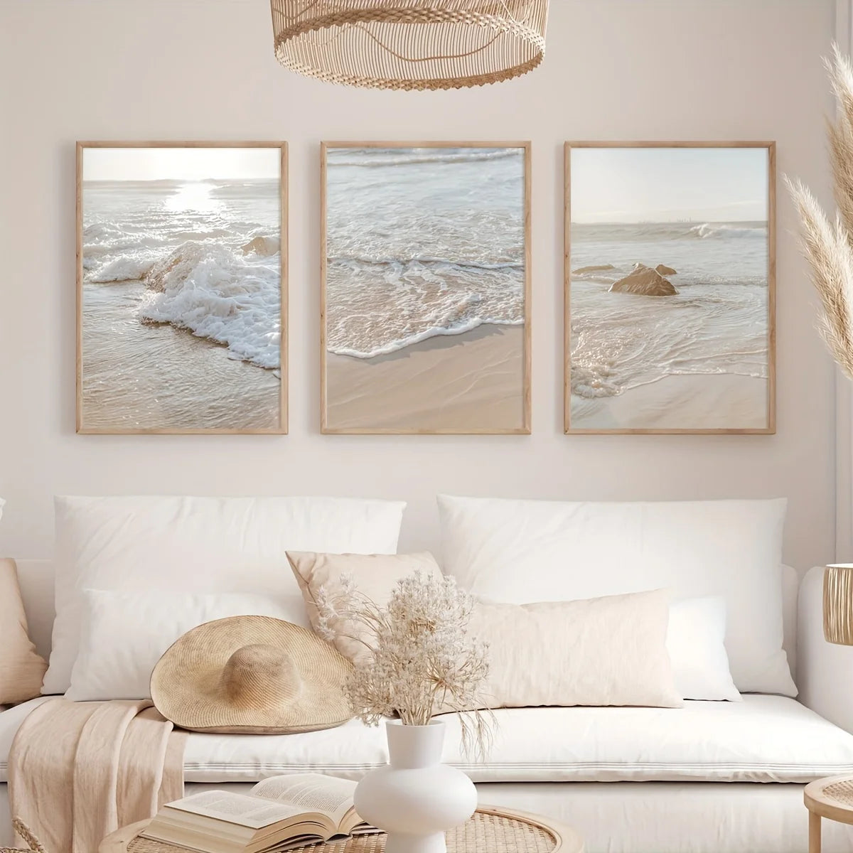 Living room with beach-themed wall art and a white sofa.