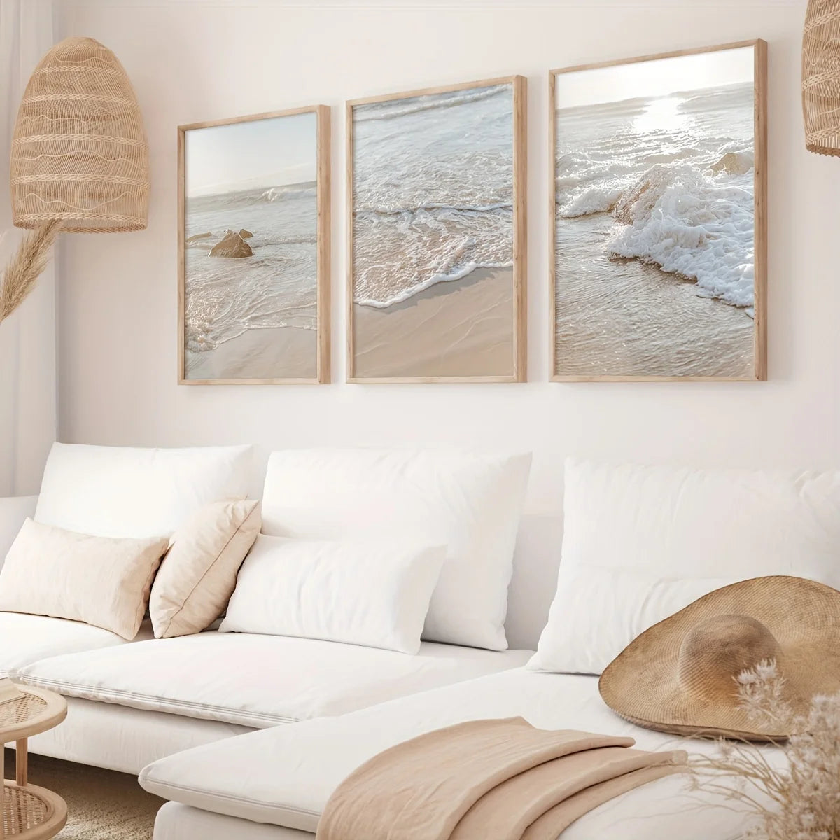 Living room with a white sofa, beach-themed wall art, and decorative items.