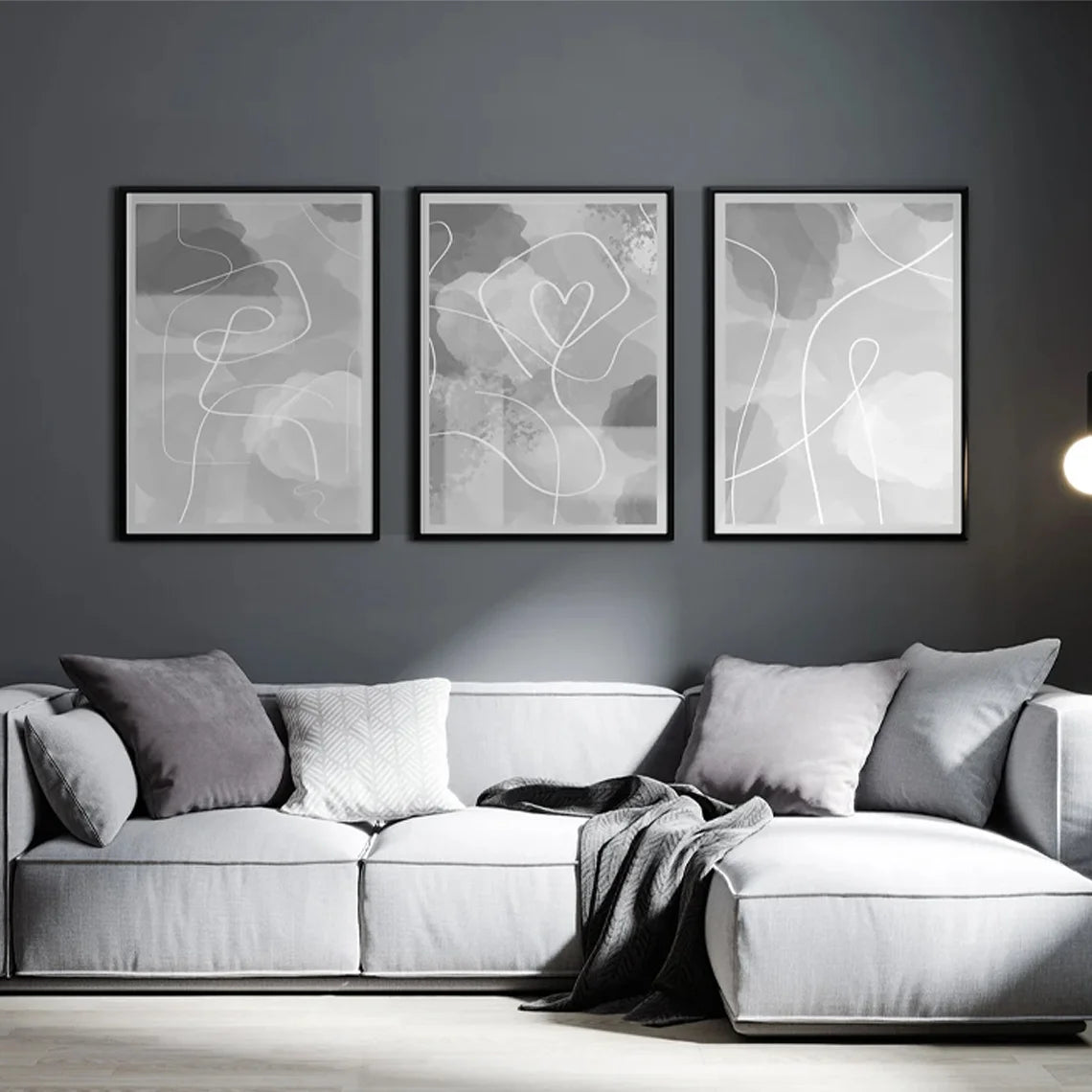 Gray sofa with abstract art on a dark gray wall