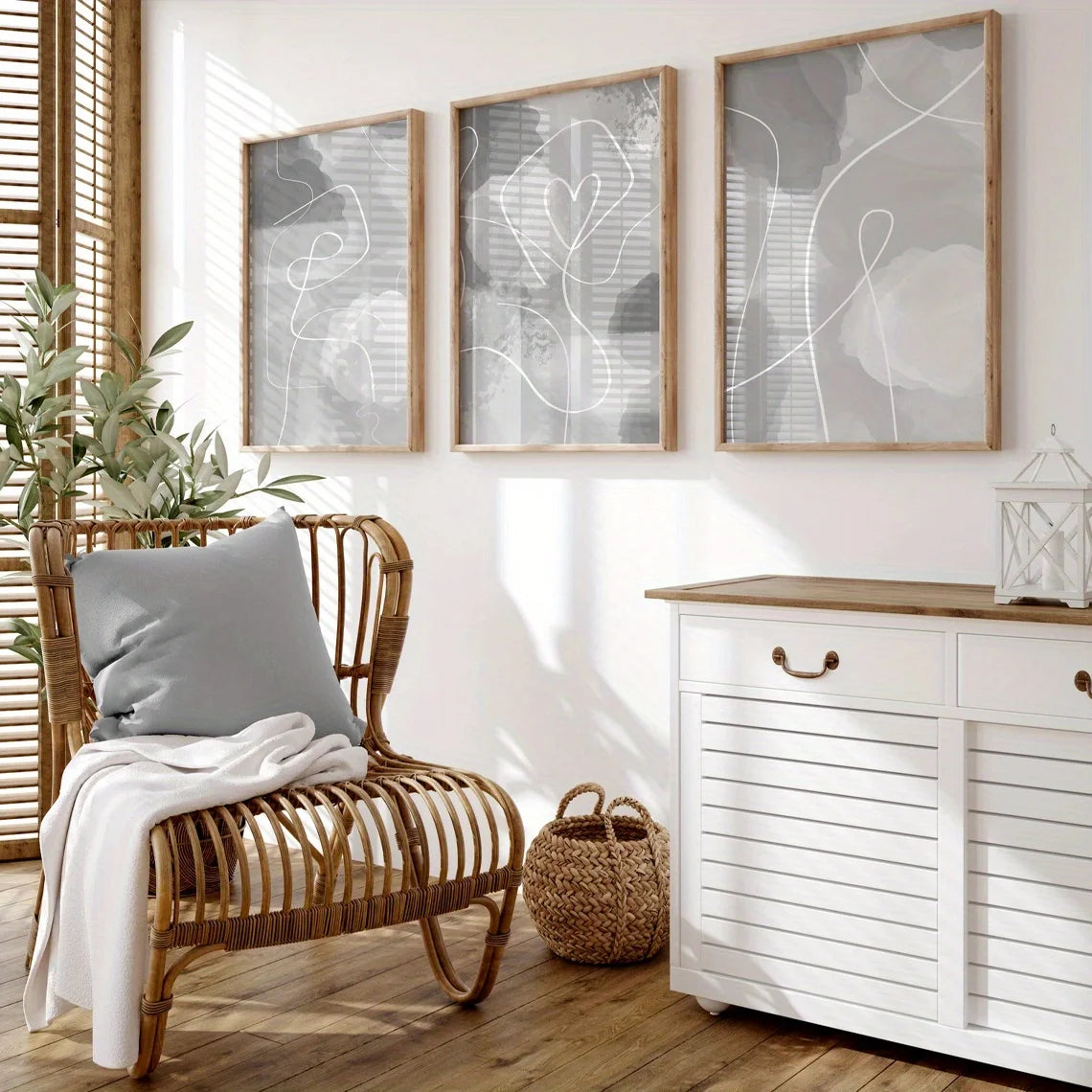 Living room with wicker chair, white cabinet, and abstract wall art