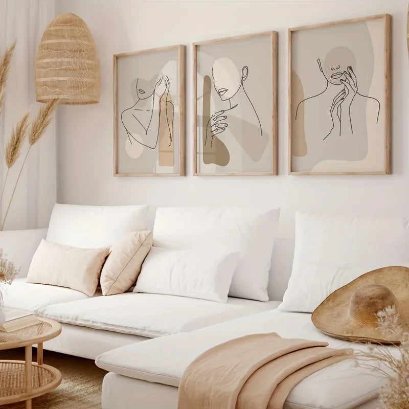 Living room with a white sofa, abstract art on the wall, and decorative elements.