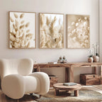 Modern living room with beige armchair, wooden console table, and floral wall art.