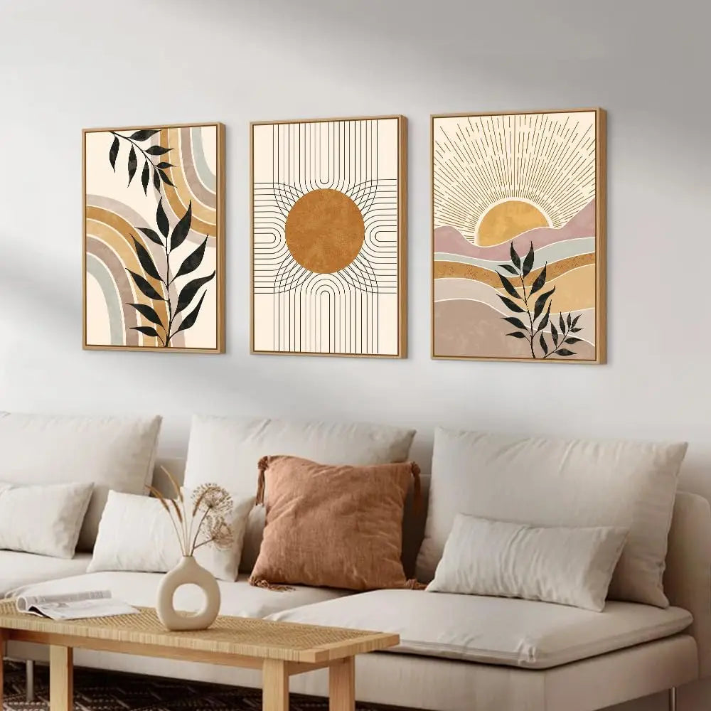 Three abstract wall art pieces above a sofa in a living room setting.