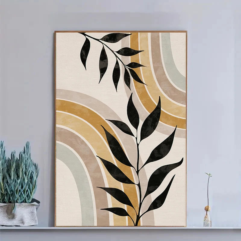 Abstract art print with black leaf design on a neutral background, framed in a room.