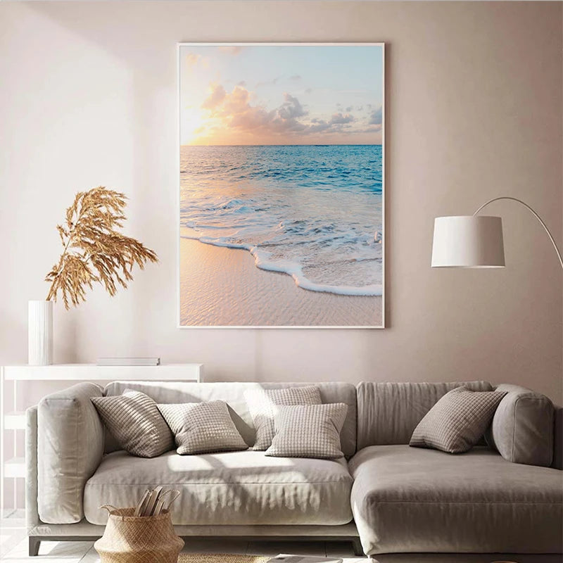 Living room with a beige sofa, decorative pillows, and a large beach scene painting on the wall.