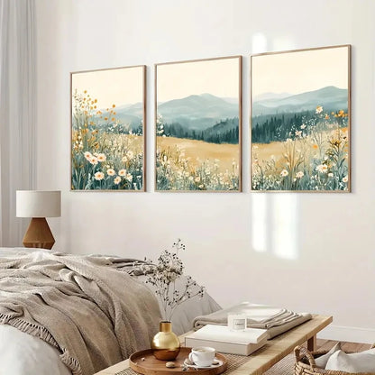 Three framed landscape paintings of fields and mountains in a bedroom setting.