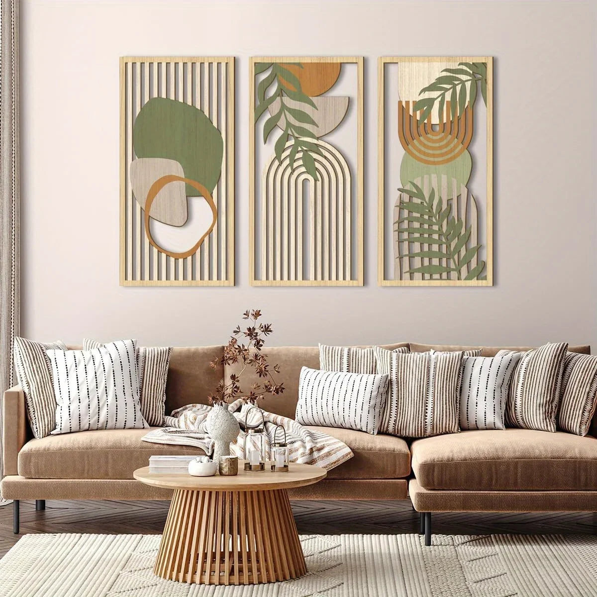 Living room with a beige sectional sofa, decorative pillows, and wall art featuring abstract designs with leaves.