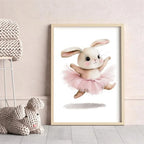 Framed artwork of a rabbit in a pink tutu on a light gray wall.
