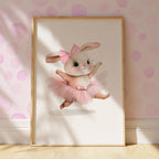 Framed artwork of a ballerina rabbit in a tutu against a polka dot wall.