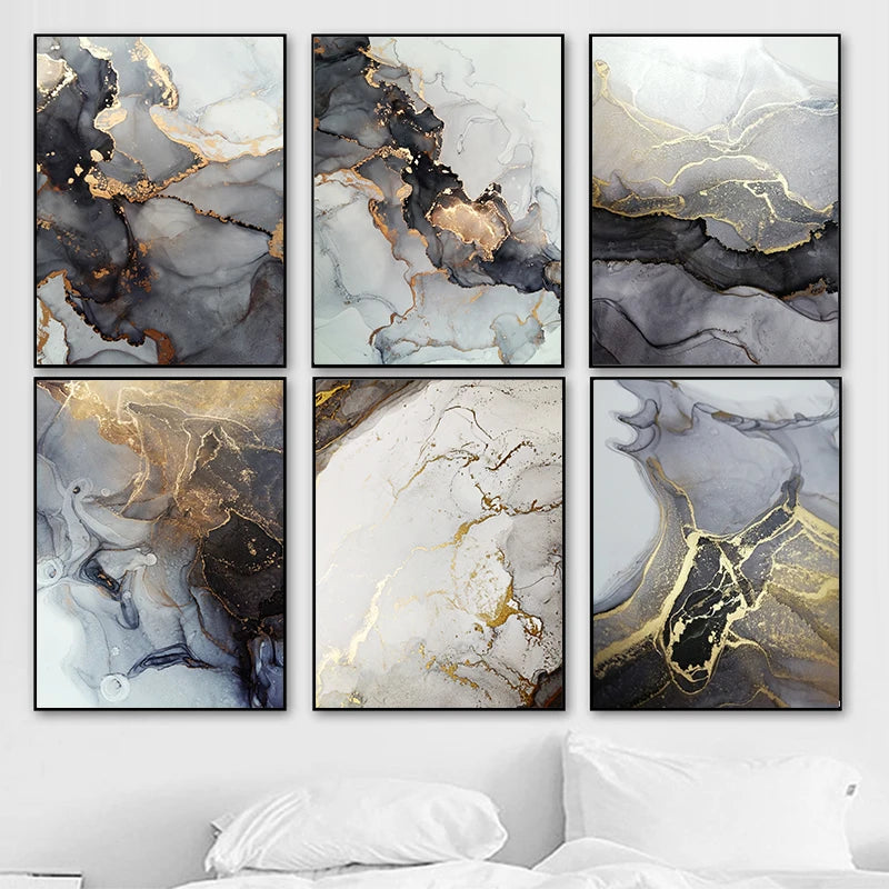 Set of six abstract art prints with gold and black accents on a wall.