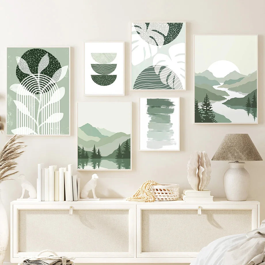 Set of six green and white abstract wall art pieces on a wall with a white console table below.
