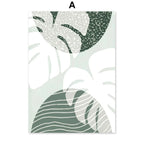 Decorative wall art with green leaf patterns on a white background