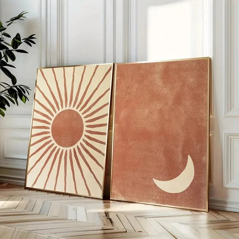Two decorative panels with sun and moon designs on a wooden floor.
