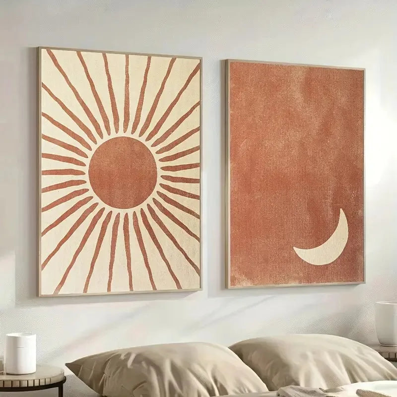 Two abstract wall art pieces on a wall above a bed.