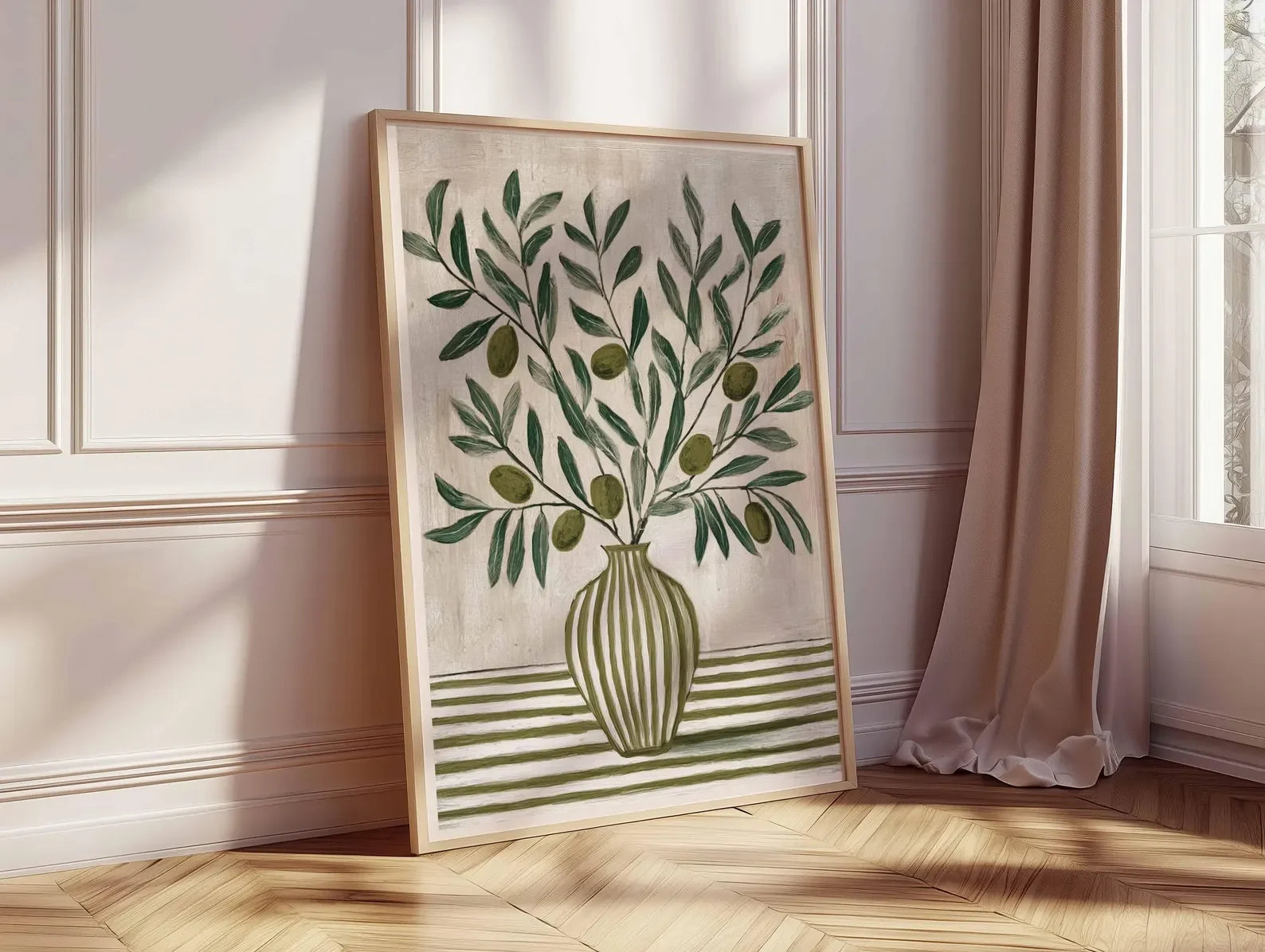 Framed artwork of a green leafy design on a beige wall.