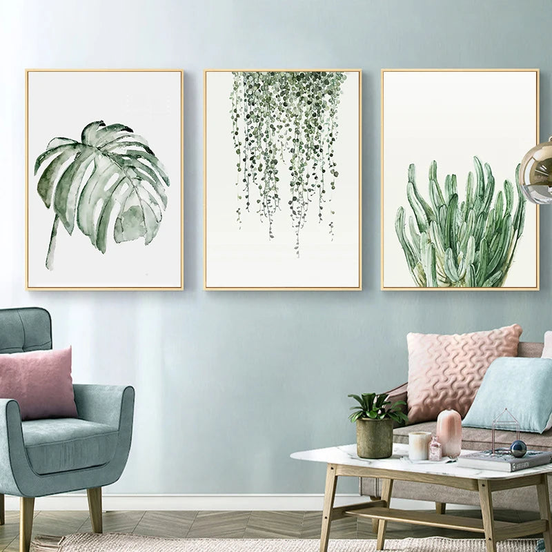Living room with three framed botanical prints on a light blue wall.