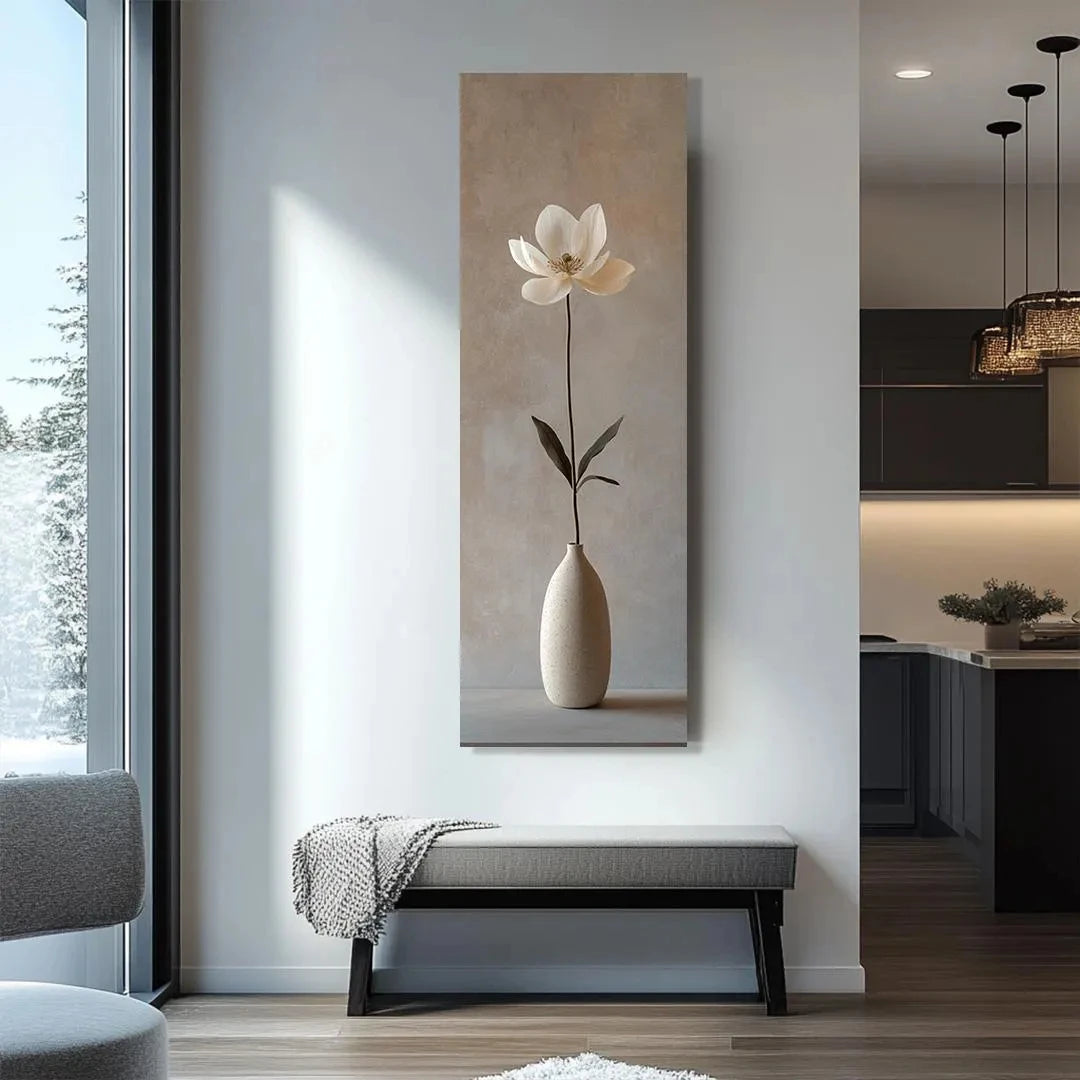 Modern interior with a large vertical artwork of a flower in a vase on a wall.