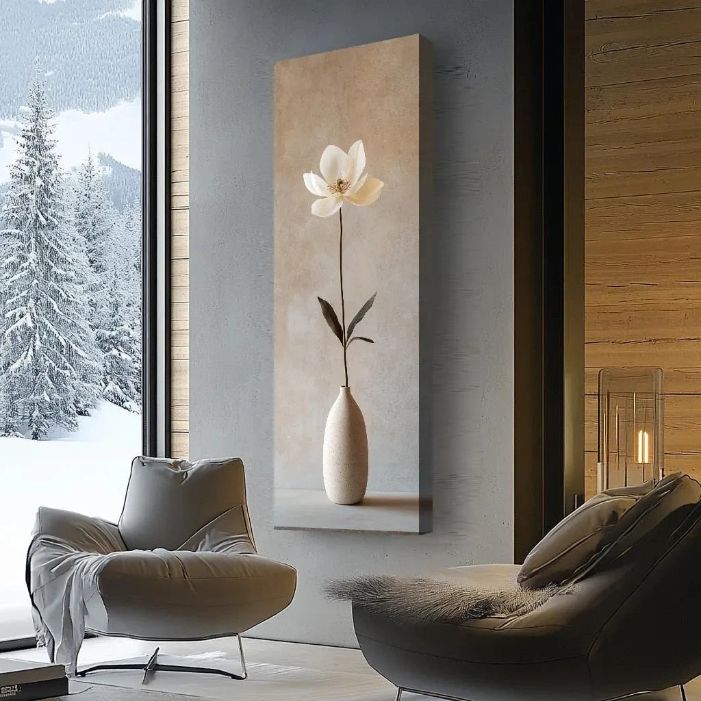 Modern interior with a large abstract painting of a white flower in a vase, a chair, and a window showing a snowy landscape.
