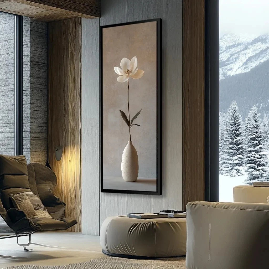 Modern living room with a large flower painting on the wall and a view of mountains.