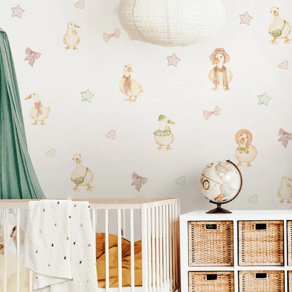 Nursery room with crib, decorative wall stickers, and wicker baskets.