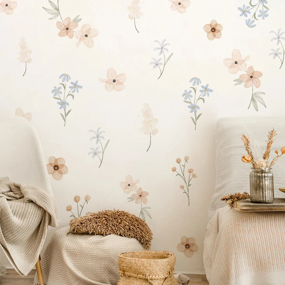 Floral wall decals on a neutral wall with a chair and table in the foreground.