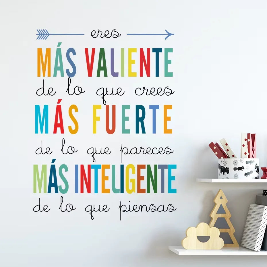 Colorful motivational quote on a white wall with decorative items below.