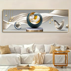 Abstract sculpture on a wall above a white sofa in a living room
