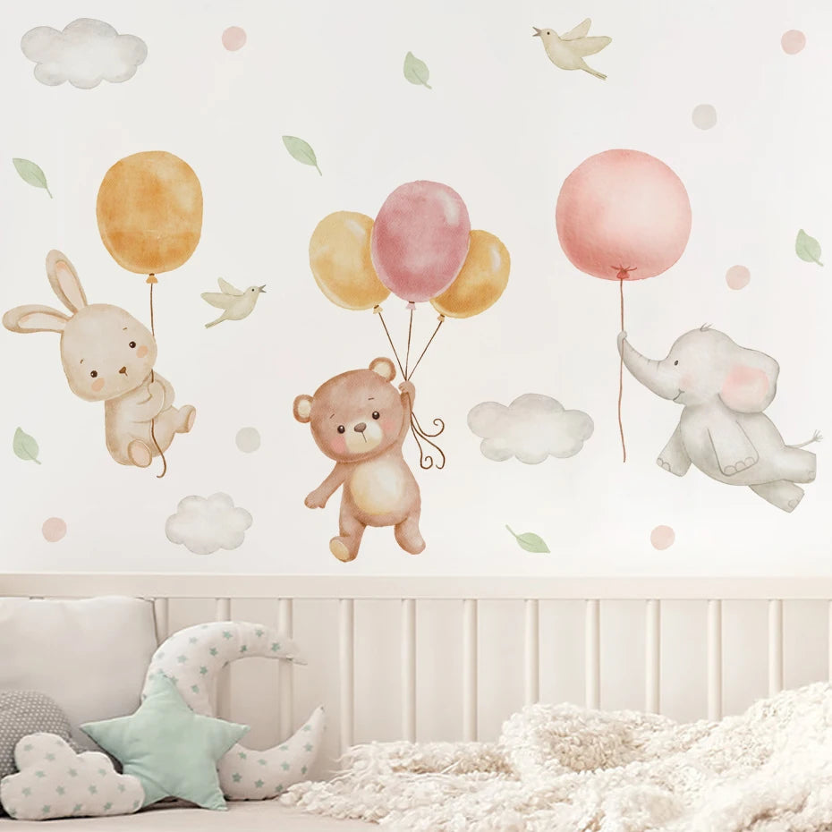 Wall decal of a bear with balloons, rabbit, and elephant in a child's room.