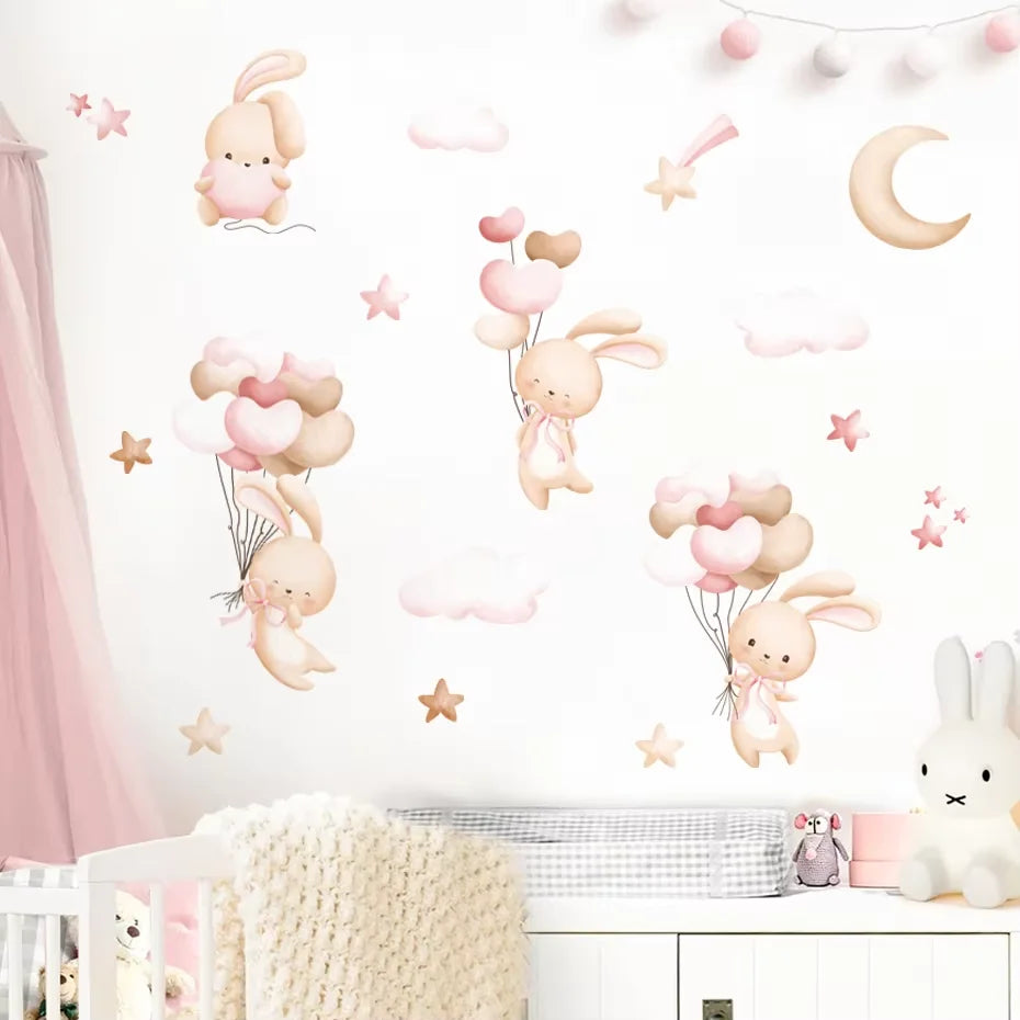 Children's room with rabbit wall decals and a crib.