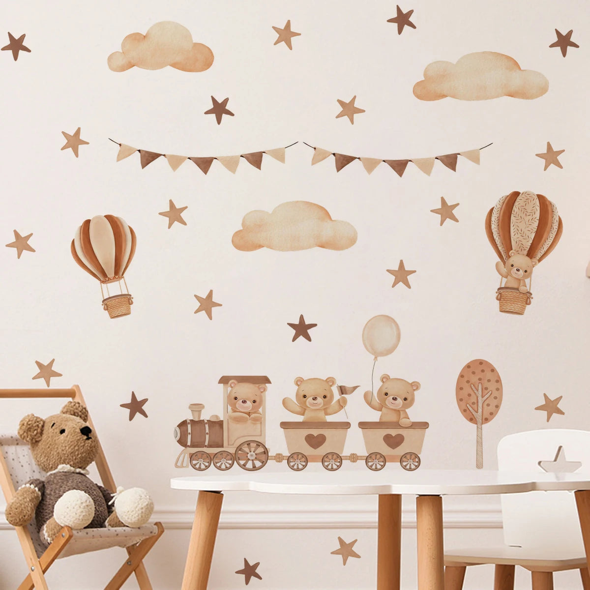 Children's room with teddy bear-themed wall decals, including hot air balloons, clouds, and a train.