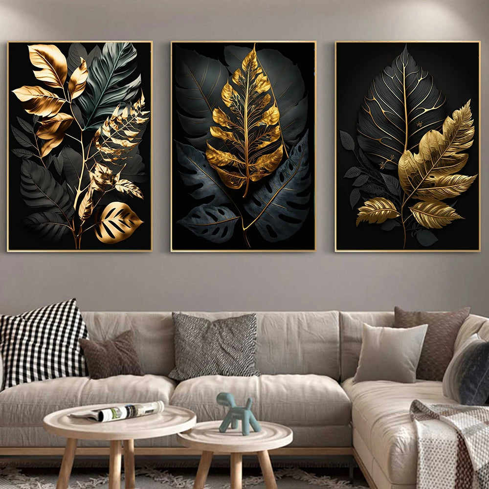Three framed leaf artworks above a sofa with decorative pillows and a small table.
