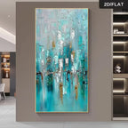 An abstract vertical canvas painting with textured brushstrokes in turquoise, teal, white, gray, and gold, displayed on a neutral wall in a modern interior setting.