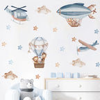 Children's room with airplane, helicopter, and hot air balloon wall decals on a light blue background.