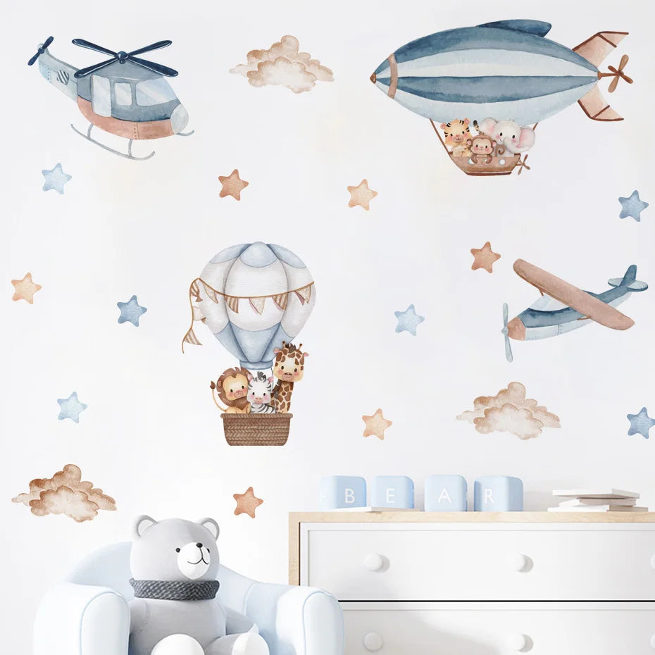 Children's room with airplane, helicopter, and hot air balloon wall decals on a light blue background.