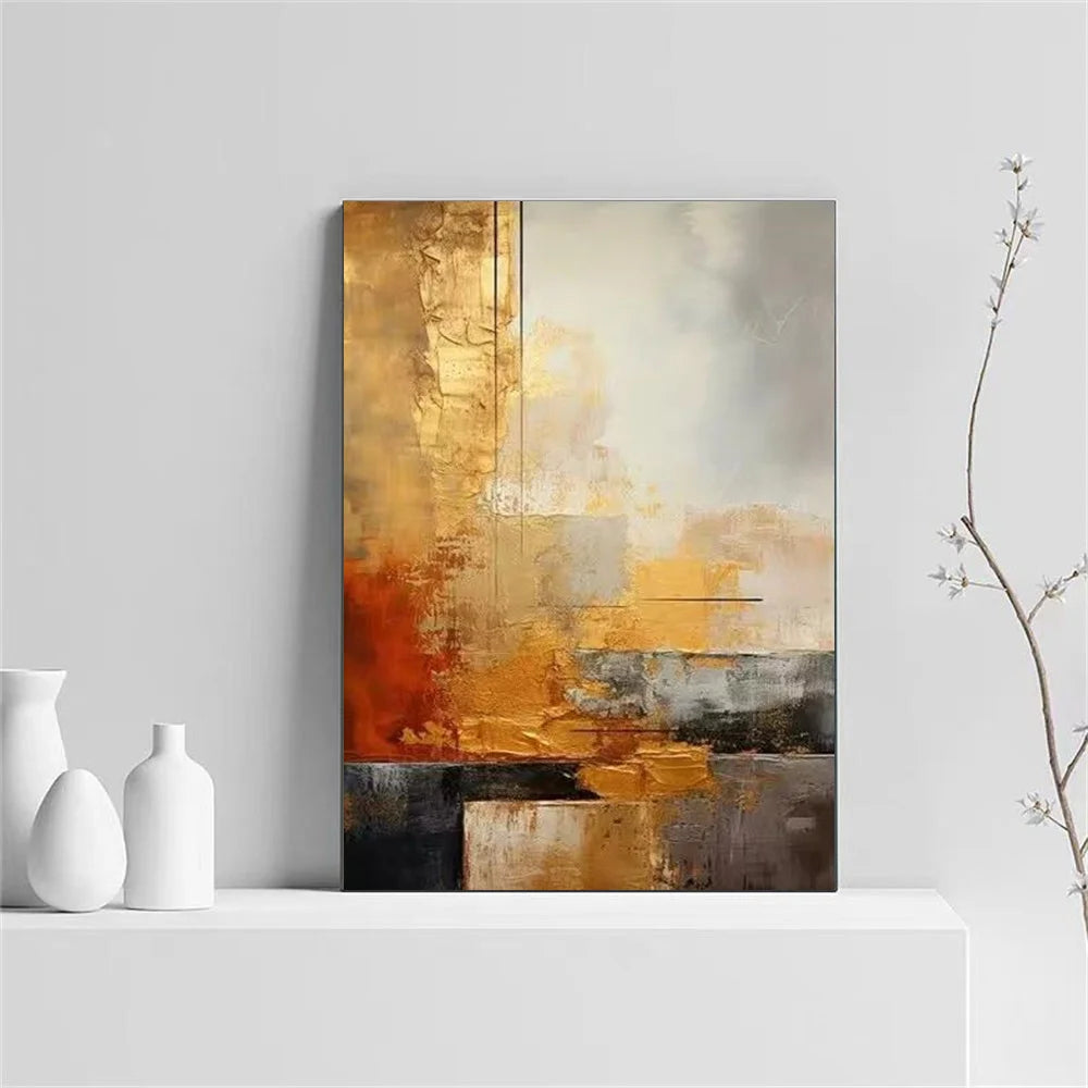 Abstract art painting with gold and brown tones on a white wall, with two white vases and a branch in the foreground.