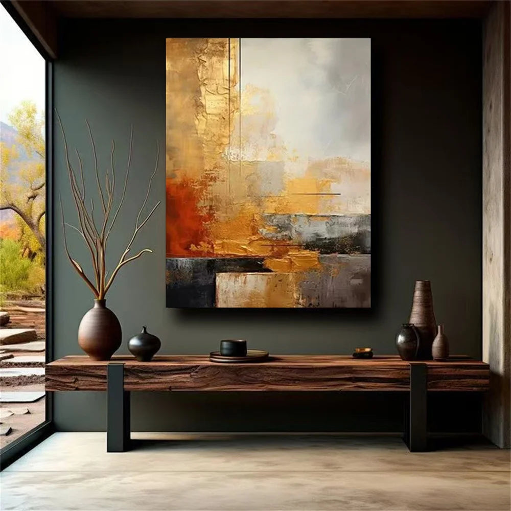 Abstract painting on a wall above a wooden console table with decorative items.