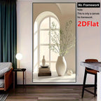 Decorative wall art of a vase with branches in a living room setting.