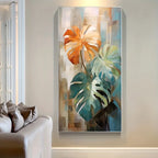Abstract painting of leaves on a wall above a sofa