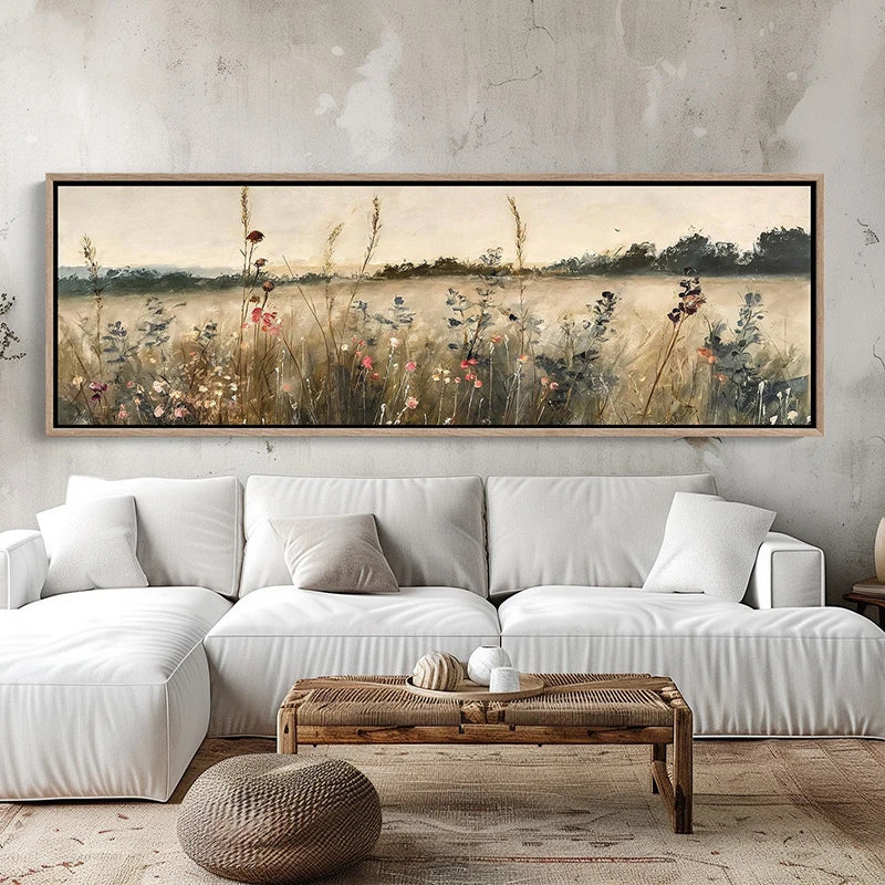 Living room with a large framed landscape painting above a white sofa.