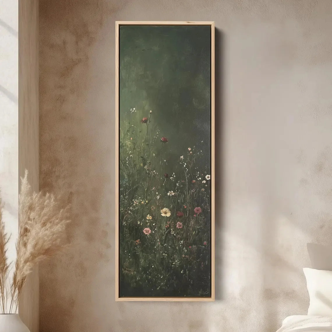 Framed artwork of a floral scene on a wall with soft lighting