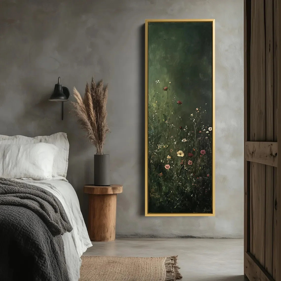 Framed artwork of a floral scene on a wall above a bed in a bedroom.