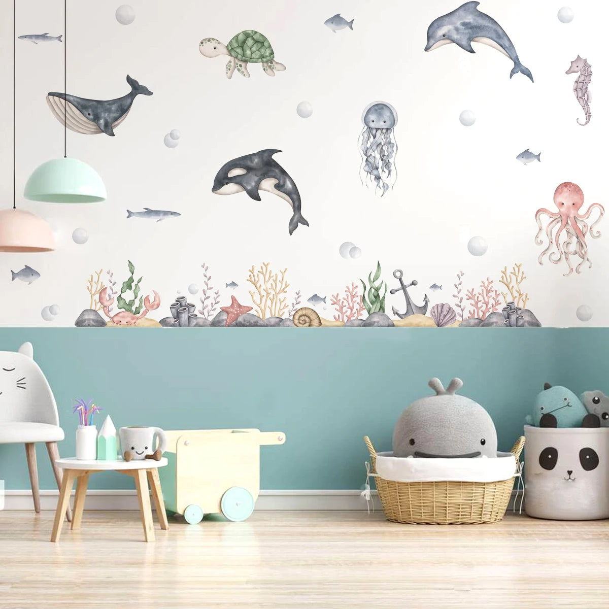 Children's room with ocean-themed wall decals and toys.