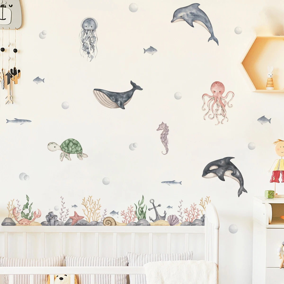 Children's room with ocean-themed wall decals on a white wall.