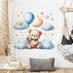 Children's room with a teddy bear wall decal, balloon, and cloud design.