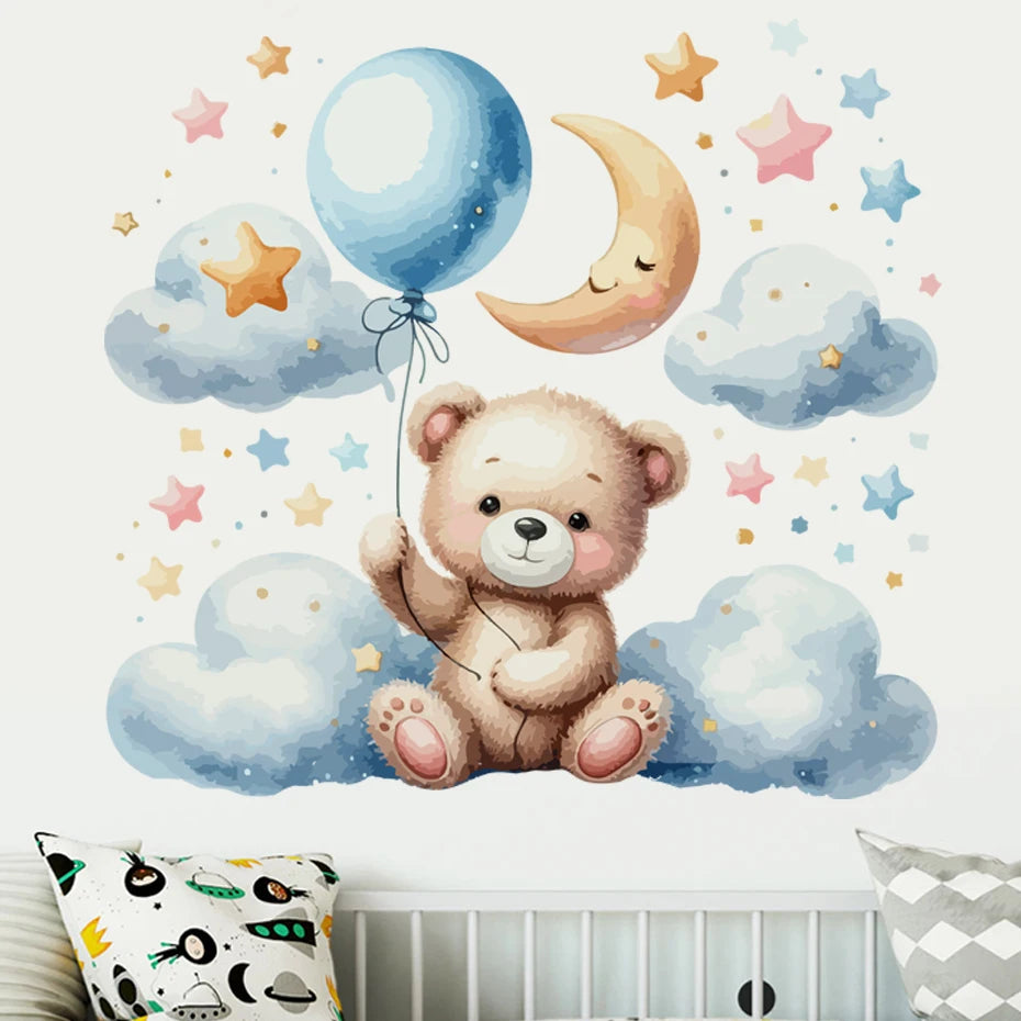 Wall decal of a teddy bear with balloons and stars on a wall above a crib.